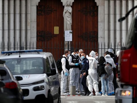 Forensic specialists inspect the area after a reported knife attack at Notre Dame church in Nice, France, October 29, 2020