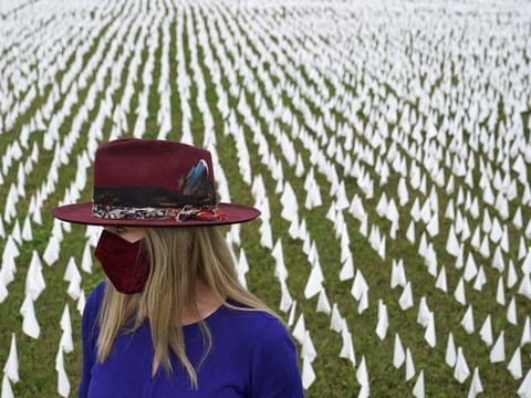 In Pictures: Art installation commemorates American lives lost from virus with planting of white flags