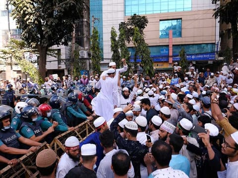 Supporters of several Islamist parties protest after Friday prayers in Dhaka, Bangladesh, Friday, Oct. 30, 2020. Thousands of Muslims and activists marched through streets and rallied across Bangladesh’s capital on Friday against the French president’s support of secular laws. 