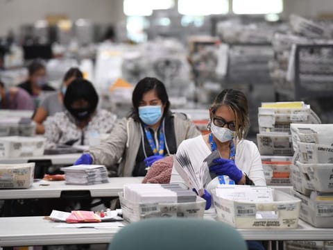 Mail-in ballots for the US presidential election are sorted at the Los Angeles County Registrar Recorders' mail-in ballot processing center at the Pomona Fairplex in Pomona, California, October 28, 2020. 
