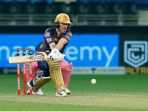 Eoin Morgan, captain of Kolkata Knight Riders, launches into a reverse sweep during IPL 2020 in the UAE. 