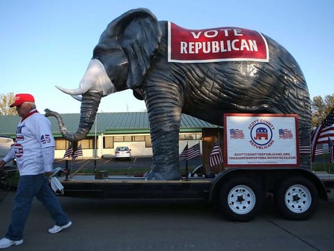 An elephant wearing a face mask is displayed outside a campaign event for Senate candidate Sen. Joni Ernst (R-IA) at Dahl Auto Museum, as part of her RV tour of Iowa, on October 31, 2020 in Davenport, Iowa. 