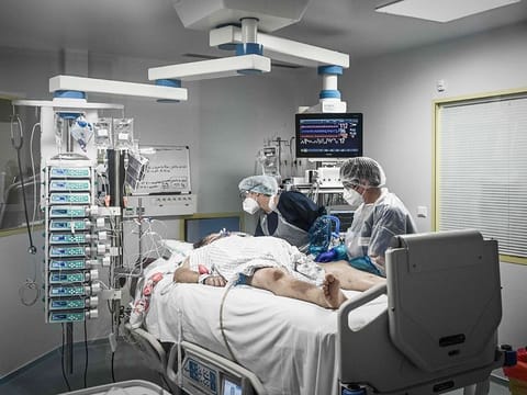For illustrative purposes only: Medical personnel attend a COVID-19 patient at the reanimation section of the Robert Boulin hospital in Libourne, southwestern France. 