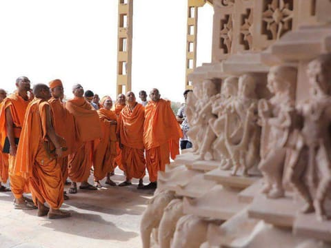 Stone pillars for the Abu Dhabi Hindu temple being inspected by temple priests at artisans’ worksite in India. The intricate carvings of the mandir range from figurines only a few inches tall to statues of many meters.