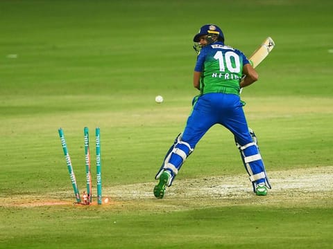 Multan Sultans' Shahid Afridi is bowled out by Lahore Qalandars Haris Rauf (unseen) during the PSL match between them at the National Stadium in Karachi on November 15, 2020.   