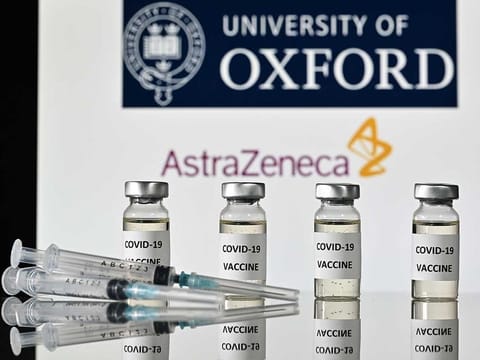 An illustration picture shows vials with COVID-19 vaccine stickers attached and syringes, with the logo of the University of Oxford and its partner British pharmaceutical company AstraZeneca, on November 17, 2020. 