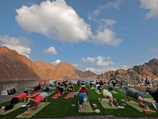 Photos: Health enthusiasts do Yoga at picturesque Hatta 