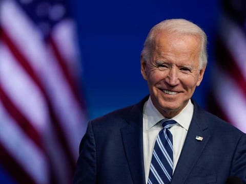President-elect Joe Biden smiles as he speaks at The Queen theatre in Wilmington