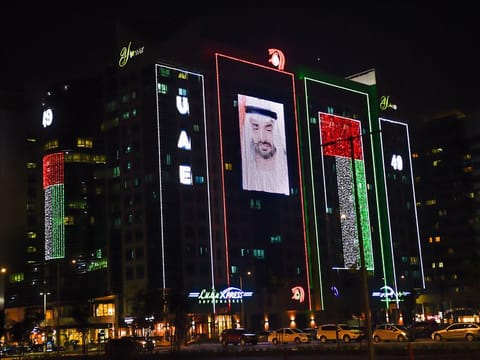 Buildings in Abu Dhabi lit up for the upcoming UAE National Day.