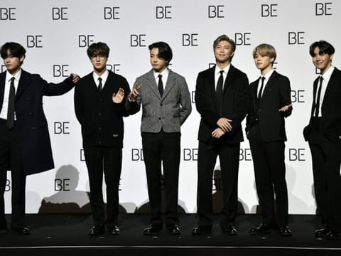 South Korean K-pop boy band BTS members (L to R) V, Jin, Jung Kook, RM, Jimin and J-Hope pose for a photo session during a press conference on BTS new album 'BE (Deluxe Edition)' in Seoul on November 20, 2020.