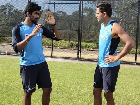 Jasprit Bumrah (left) has word of advice for young fast bowler Kartik Tyagi during India's tour of Australia late last year.