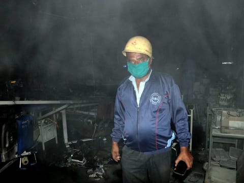 A firefighter seen at the COVID-19 ICU ward where a fire broke out, at Uday Shivananda Hospital in Rajkot on Friday.
