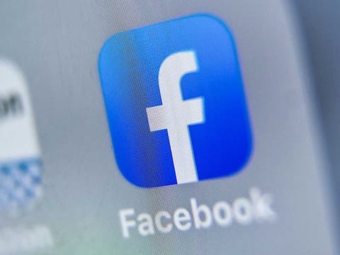 This file photo taken on August 28, 2019 shows the logo of US online social media and social networking service, Facebook displayed on a tablet in Lille. Facebook announced it is buying a startup specializing in helping businesses interact with customers online.