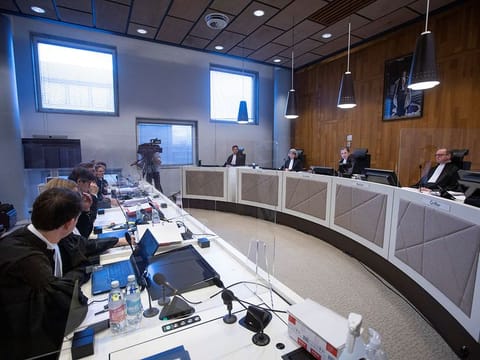 Lawyers for Milieudefensie and Shell listen as presiding judge Larisa Alwin, center right, opens the court case environmentalist and human rights groups have brought on against Royal Dutch Shell to force the energy firm to cut its reliance on fossil fuels, in The Hague, Netherlands December 1, 2020. 