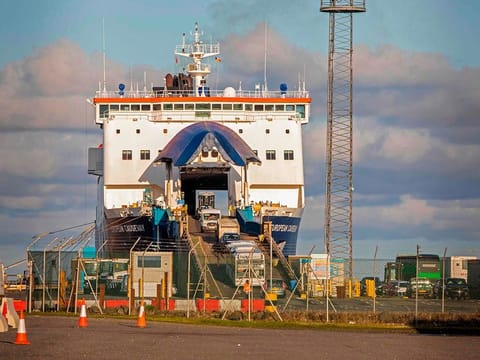 Vehicles drive off a P&O ferry at the Port of Larne in Co Antrim, Northern Ireland on December 6, 2020.