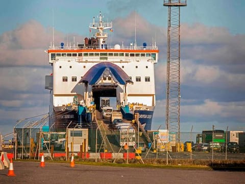 Vehicles drive off a P&O ferry at the Port of Larne in Co Antrim, Northern Ireland on December 6, 2020.