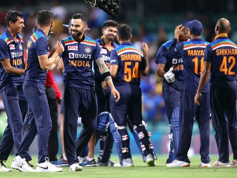 India's captain Virat Kohli (3rd L) celebrates victory against Australia with teammates after the second T20 match at the Sydney Cricket Ground on December 6, 2020. 