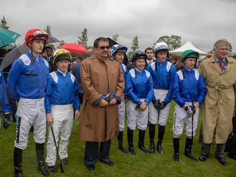 Sheikh Hamdan with Richard Lancaster, Shadwell Stud Director, and jockeys from the stable during one of his Newbury visits.