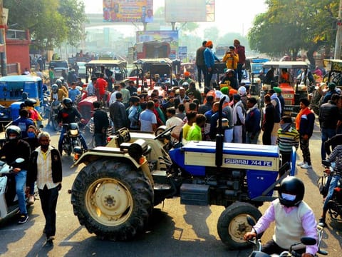 Farmers protest with their tractors against new farm laws in India 