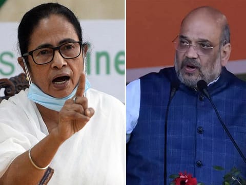 West Bengal Chief Minister and Trinamool Congress chief Mamata Banerjee and India's federal Home Minister and BJP leader Amit Shah. 