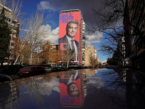 A giant electoral poster of Barcelona presidential hopeful Joan Laporta is seen on a building next to the Santiago Bernabeu Stadium in Madrid.