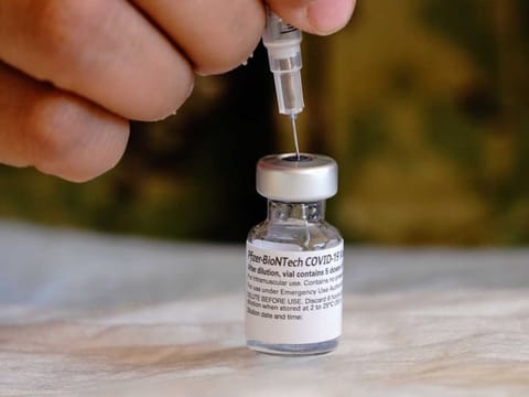A dose of the Pfizer-BioNTech COVID-19 vaccine is prepared at the Naval Medical Centre San Diego in California, US, on December 15, 2020. The first Covid-19 vaccine shots were administered by US hospitals on December 14, 2020, the initial step in a historic drive to immunise millions of people as deaths surpassed the 300,000 mark. 