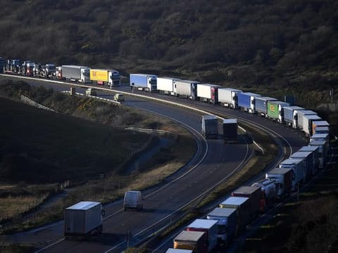 The Dover Traffic Access Protocol (TAP) scheme on the A20 is seen in action as freight lorries queue on the main route into the port of Dover on the south coast of England on December 17, 2020.