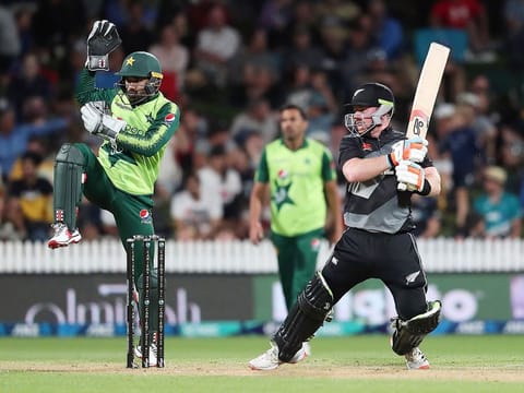 New Zealand’s Tim Seifert (R) plays a shot as Pakistan's wicketkeeper Mohammad Rizwan looks on during the second T20 at Seddon Park in Hamilton.  