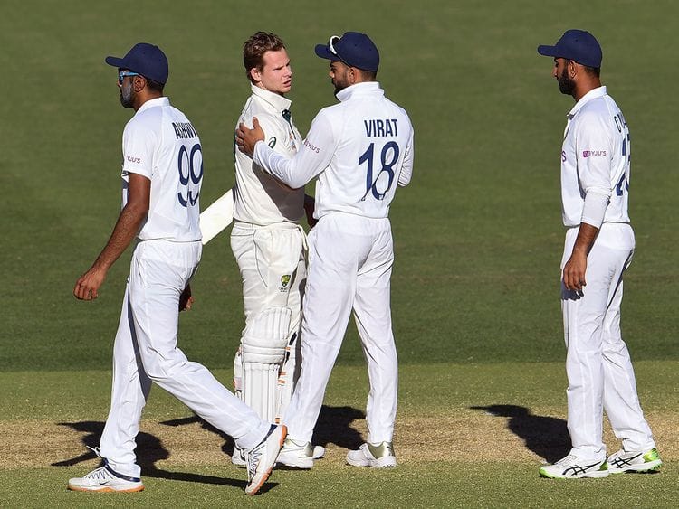 Australia's Steve Smith (2nd L) talks with India's Virat Kohli 