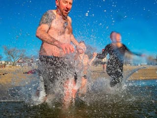 Photos: Crowded January 1 'polar plunges' put on ice