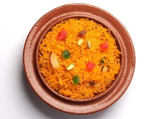 Zarda Pulao or sweet rice with orange and chicken 