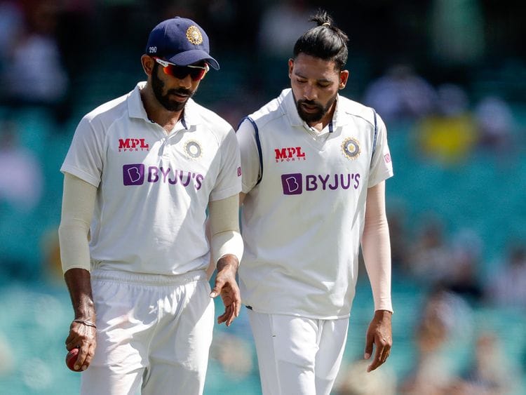Indian bowler Jasprit Bumrah, left, and Mohammed Siraj in discussion