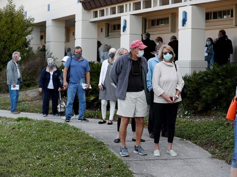 Seniors, who are 65 and over, wait in line at the Department of Health Sarasota COVID-19 vaccination clinic in Sarasota, Florida. [Illustrative image]  