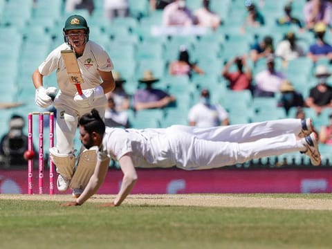 Australia's Marnus Labuschagne plays the ball past Indian bowler Mohammed Siraj during play on day four of the third cricket test between India and Australia at Sydney Cricket Ground.