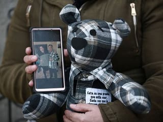 Photos: Woman sews bears from COVID-19 victims' clothing