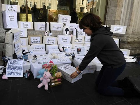 Funeral boxes, each representing a dead child, are placed together at a  procession in remembrance of the bodies of the infants discovered in a septic tank, in 2014, at the Tuam Mother and Baby Home, in Dublin, Ireland October 6, 2018.