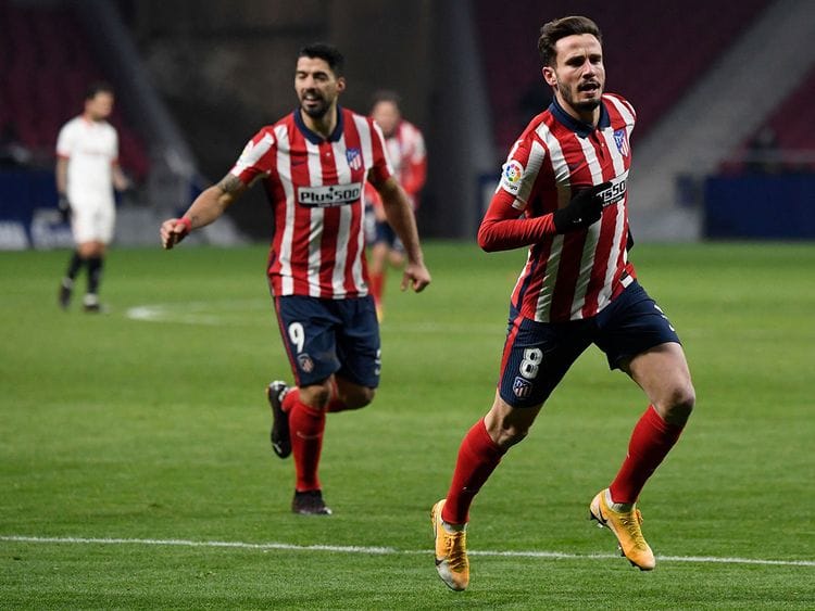 Atletico Madrid's Spanish midfielder Saul Niguez celebrates scoring his team's second goal during the Spanish League football match between Atletico Madrid and Sevilla at the Wanda Metropolitano stadium in Madrid.