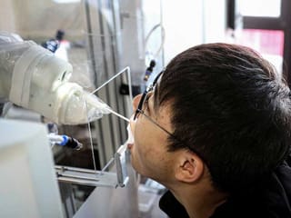 Chinese robots take throat swabs to fight COVID-19 outbreak