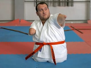 In pictures: Gaza man with disabilities conquers karate 