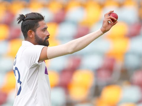 High Fives: India's Mohammed Siraj gestures with the ball as he leaves the field after taking five wickets during the fourth Test in Brisbane.