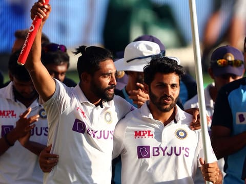 Shardul Thakur (right) and Mohammed Siraj celebrate India's victory in the fourth Test against Australia at The Gabba in January.