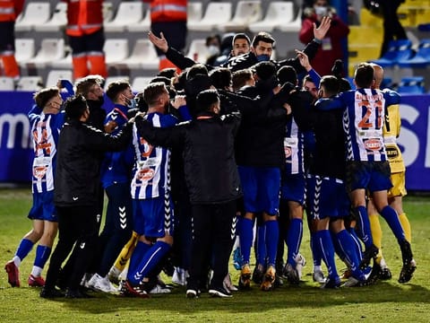 Alcoyano players celebrate after knocking Real Madrid our of the Copa del Rey.