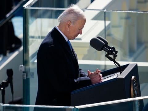 President Joe Biden pauses for a moment of silent prayer to remember those who died of COVID-19 during his inaugural speech at  the Capitol in Washington on Wednesday, Jan. 20, 2021. 