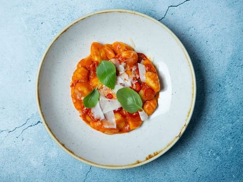 Melt-in-your-mouth potato gnocchi cooked in a tomato and basil sauce 