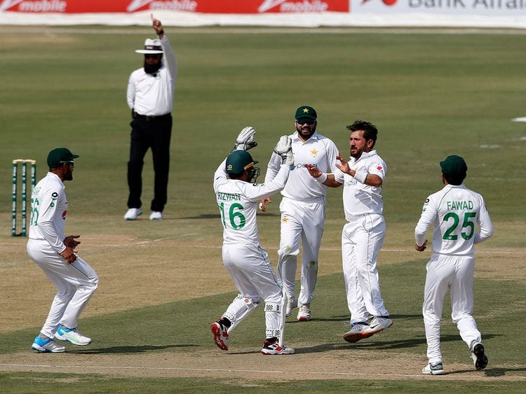 Pakistan's spinner Yasir Shah, second from right, celebrates with teammates on the dismissal of South Africa's Faf du Plessis