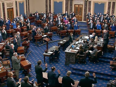 In this image from video, Sen. Patrick Leahy,  the president pro tempore of the Senate, who is presiding over the impeachment trial of former President Donald Trump, swears in members of the Senate for the impeachment trial at the US Capitol 