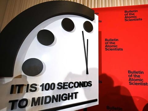 The Doomsday Clock reads 100 seconds to midnight.