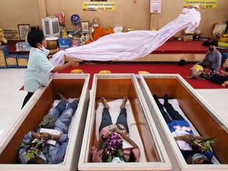 Photos: Thais seek to restore fortunes with mock funerals