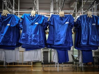 Photos: Battling COVID-19 in the laundry of a Paris hospital