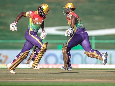 Bangla Tigers captain Andre Fletcher (left) and Jonathon Charles cross over for a single during their chase at the Abu Dhabi T10 on Saturday. 